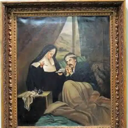 A framed painting of a nun reading to a bedridden man, who holds her hand. The scene is indoors with a window showing a landscape in the background. A table with a cloth and items sits beside the bed.
