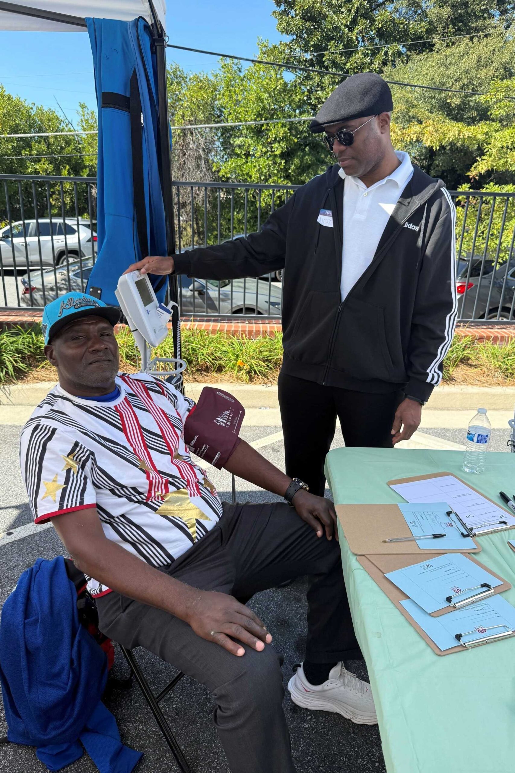 man receiving blood pressure screening