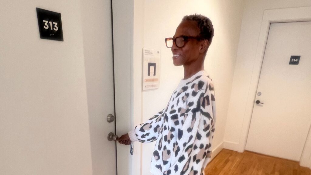 sonja at her new apartment door
