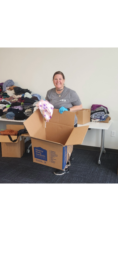woman organizing donated clothing