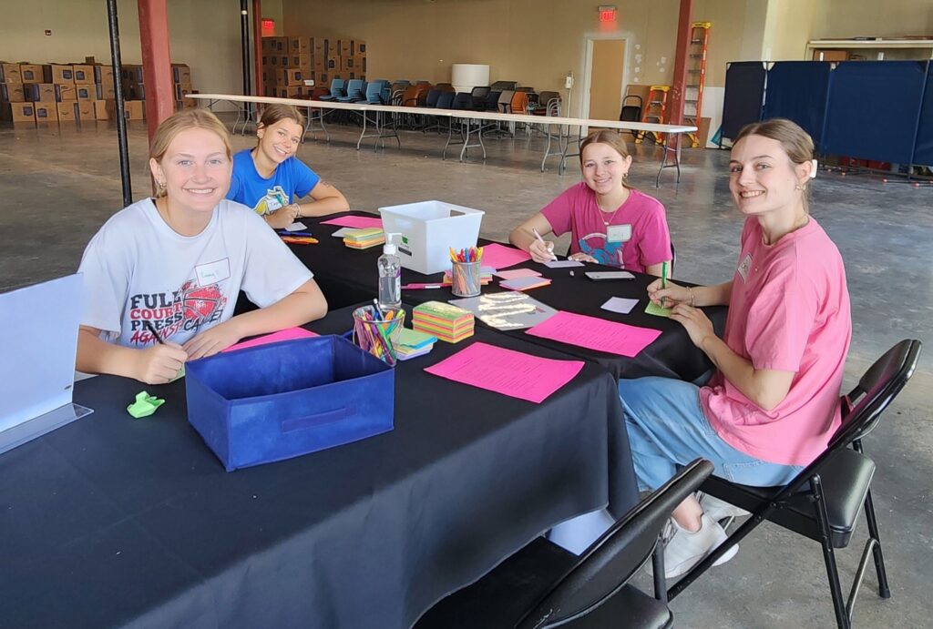 volunteers writing encouragement cards